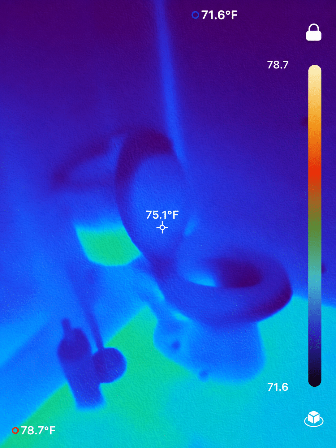 Thermal imaging used to locate a hidden plumbing leak behind a toilet in Mobile, Alabama.